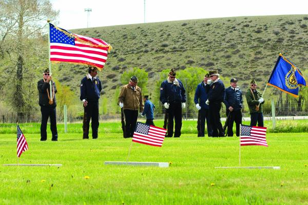 John Hauck, former VFW commander, commanded fellow American Legion members during the Memorial Day remembrance ceremony at the Ennis Cemetery Monday Morning, May 27. (H. Kearse)