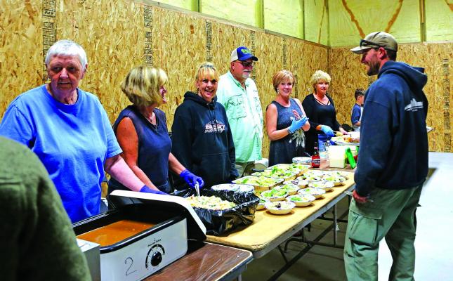 More than a dozen Ennis community members volunteered to make and serve dinner to members of the Southern California Interagency Incident Management Team (SCIIMT) August 13, when it was discovered their catering truck wouldn’t arrive until the next night. (Photos courtesy of Terri James)