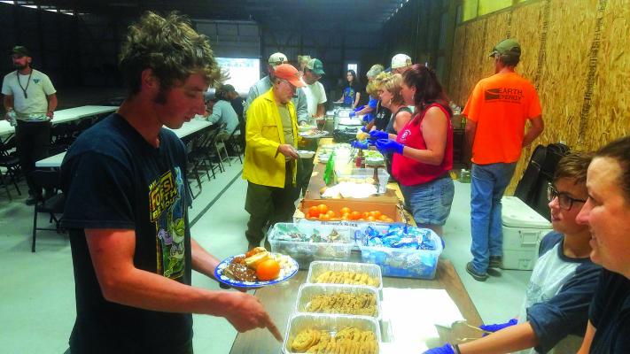 More than a dozen Ennis community members volunteered to make and serve dinner to members of the Southern California Interagency Incident Management Team (SCIIMT) August 13, when it was discovered their catering truck wouldn’t arrive until the next night. (Photos courtesy of Terri James)