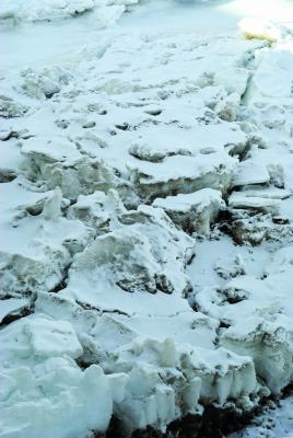 Huge chunks of ice like these collecting and damming the flow of the river are the source of ice gorges