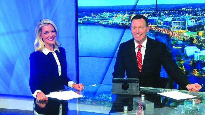 Macleod Hageman (right) of KWWL, an Iowa television station, won a regional award for evening newscast