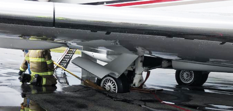 Madison Valley Fire Department attempt to stop a sinking aircraft at the Ennis – Big Sky Airport July 15. PHOTO COURTESY MADISON COUNTY COMMISSIONERS