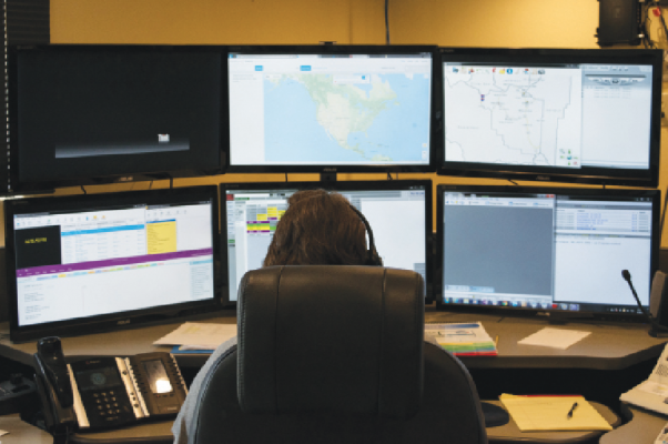 Madison County 911-Dispatch Communication Manager, Lynda Holt, using the current computer-aided dispatch system, Swift Justice, at the Madison County Dispatch office on July 26. PHOTO BY HANNAH KEARSE