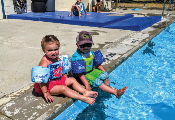 Sheridan locals, Braeden and Mallory Gilman, hang out poolside at the Sheridan public pool Aug. 14. Photo by Susanne Hill