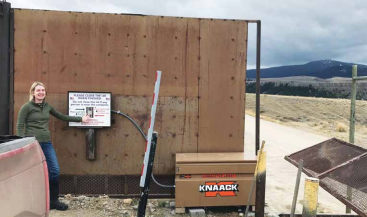 Austin White uses push-button controls to close the dumpster at the Palisades container site. Austin and her family live in the Upper Madison area. PHOTO COURTESY STEVE PRIMM