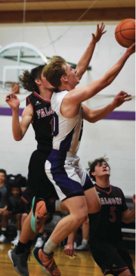 Harrison senior Kyle Homner takes it to the hole in their Friday game versus Twin Bridges. Harrison pulled ahead for the win, scoring 62 to Twin Bridges’ 46. PHOTO COURTESY ANDREA CHRISTENSEN