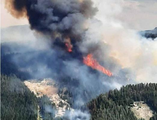 The Clover Fire burns near the Middle Fork of Warm Springs on Saturday. PHOTO COURTESY BRUCE RICHARDS