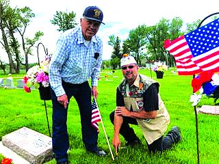 On Saturday morning, May 24 at 9 a.m., American Legion members put out flags on the veteran graves at the Ennis Cemetary. The veterans divided the cemetery into five sections denoting the grave of each veteran. Above Ennis Post No. 65 Commander Lee Sargent and Jim Masson put out flags in observance of the veterans who sacrificed so much so that we may be a safe and free people.