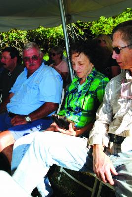 Participants examine an actual grizzly back foot, to learn about tracks.