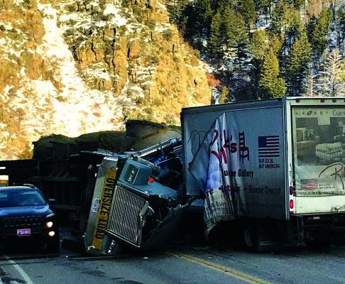A delivery truck and an oversized hay hauler collided, resulting in a fatality, Friday, February 22. (C. Leonard)