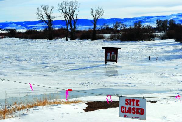The Ennis FAS is flooded and iced over.