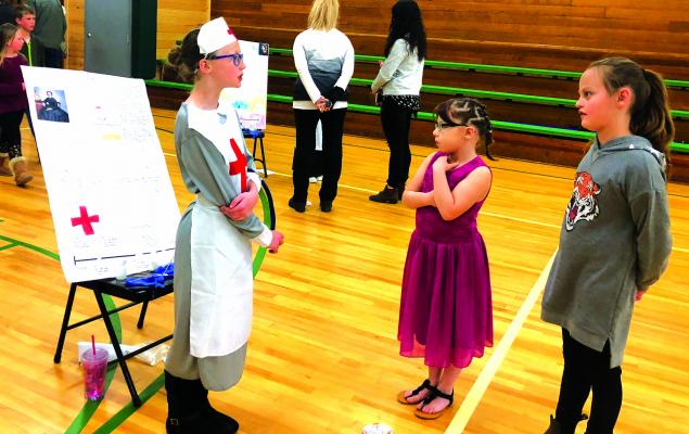 lorence Nightingale (Isabelle Hawkinson) explains to other student visitors the healing she brought to medicine during the Crimean War of the 1850s.