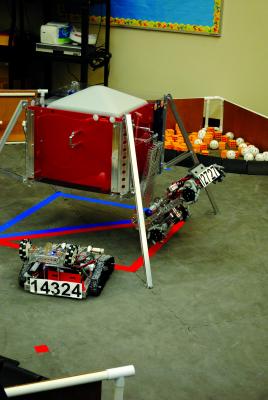 A robot climbs up the side of a structure to dock like a Mars Rover might do.