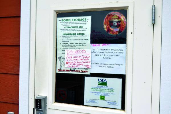 A sign at the Ennis U.S. Forest Service office lets visitors know that the office will be closed until the partial federal government shutdown is lifted. The Forest Service, overseen by the U.S. Department of Agriculture, is unfunded during the shutdown. (R. Colyer)