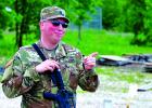 Virgina City-based Staff Sgt. Christopher Sturgill, a sheriff’s deputy with the Madison County Sheriff’s Office wears both Army green and police blue... well, tan and brown actually.  (Sumbitted)