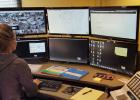 A Madison County dispatcher monitors over six screens which provide information for emergencies. Information may come in the form of text, maps or pictures. When a response vehicle goes in route to a scene, the progress of the response is mapped by a computer-aided design system (CAD). Dispatchers can assure a caller that help is not only on the way, but they can advise on a time for arrival.
