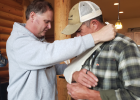 Outfitter Joe Dilschneider practices tying a sling on Mike Lum during the backcountry medicine course at the Madison Valley Ranch Dec. 7.  Photo provided by Jillian Acosta