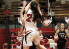 Freshman Falcon Callie Kaiser pulls in a rebound in the first half against the Whitehall Trojans Jan. 10 PHOTO BY HANNAH KEARSE