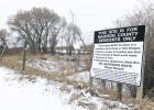 Residents from the county’s northern border convinced the Madison County Solid Waste and Recycling Board on Jan. 9 to do environmental testing at the Cardwell dumpsite. The river lies just beyond the fence surrounding the site. PHOTO BY CORI KOENIG