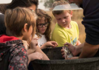 Montana Fish, Wildlife and Parks Conservation Technician Lucas Bateman shows Twin Bridges’ students a whitefish during Kids’ River Resource Day at the Hamilton Ranch in Twin Bridges Sept. 17. PHOTO BY HANNAH KEARSE