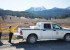 Assistant Fire Management Officer for the West zone of the Custer Gallatin National Forest, Jay Fassett, and Big Sky Fire Department’s Crystal Beckman scope out the Shedhorn wildfire burning in the upper drainage of the Taylor Fork on Oct. 1. PHOTO BY JOHN STEMBER