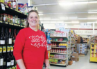 Madison Foods owner Chris Gentry purchased Madison Foods in 2003. Her jingle all the way shirt draws attention to the first big snowstorm of the year brewing outside P Photo by Jolene Palmer
