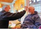 Madison Valley Medical Center EMT Corey Siders visits with 91-year-old Robert Kensinger in Ennis, Montana as part of the hospital’s community paramedicine program. Kensigner says these visits help him remain safely living in his home. PHOTO COURTESY AARON BOLTON, MONTANA PUBLIC RADIO