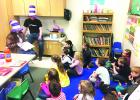Sandy Moore & Zane Bowey read Horton Hatches the Egg to the Kindergarten class.
