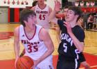 Harrison Wildcat Vern Homner (5) guards Twin Bridges Falcon Clay Wolfe (35) during a game in Twin Bridges on Feb. 9. The Falcons rolled to a 70-45 victory. (G. Hamill photos)